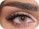 Close-up of an eye wearing Luminous Hazel colored contact lenses